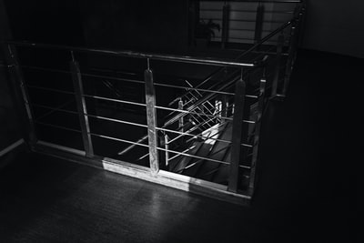 Grayscale images with a stair rail
